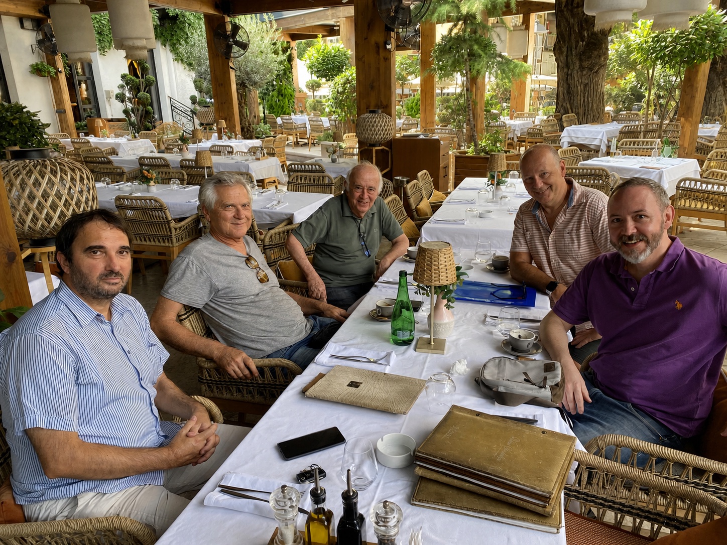 Five members of the Medicorder team seated together at a table